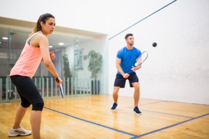Couple playing squash